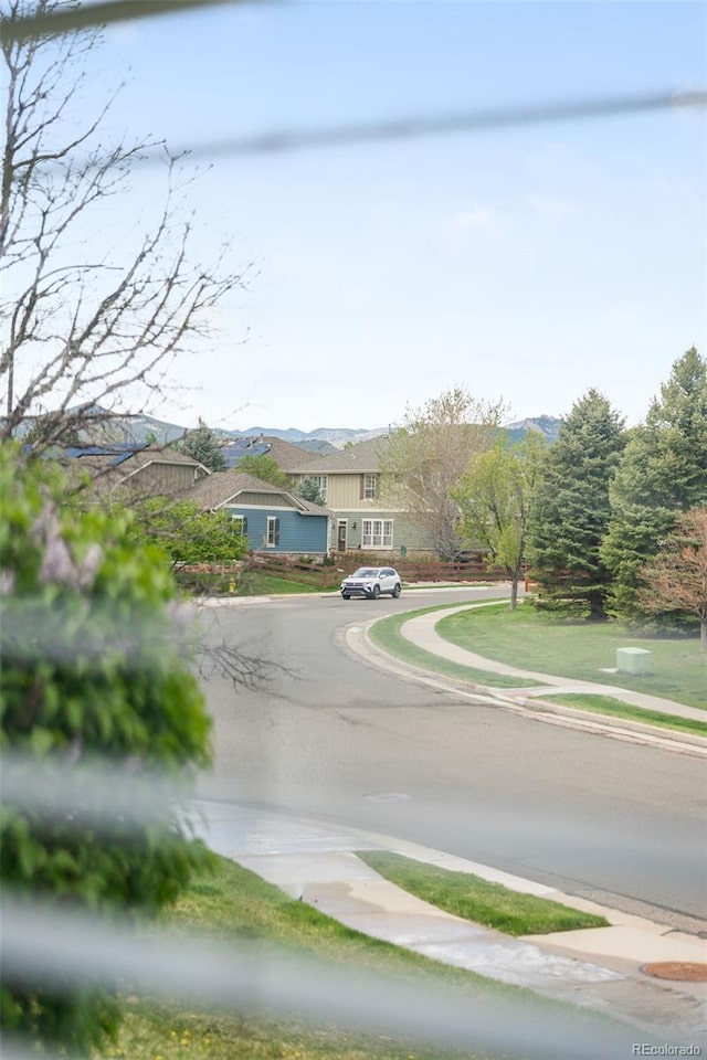 6193 Terry Ct, Arvada, CO 80403 - view of asphalt road featuring sidewalks and curbs