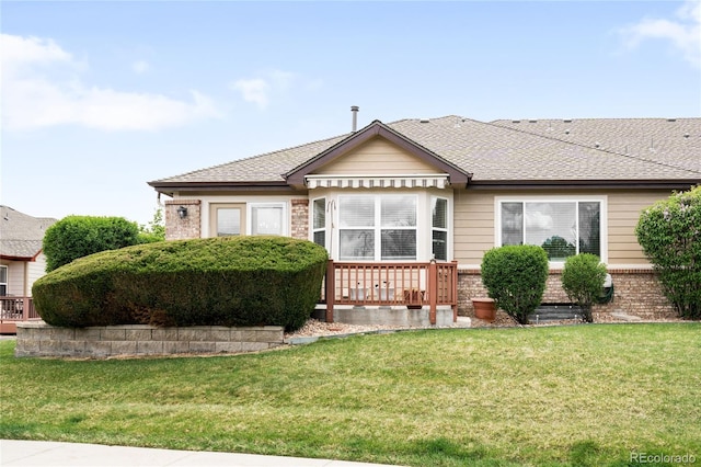 6193 Terry Ct, Arvada, CO 80403 - view of front of home featuring a front yard, brick siding, and a shingled roof