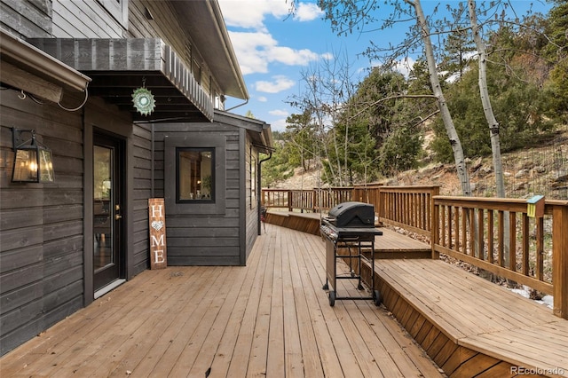 6640 Kilimanjaro Dr, Evergreen, CO 80439 - wooden terrace featuring area for grilling