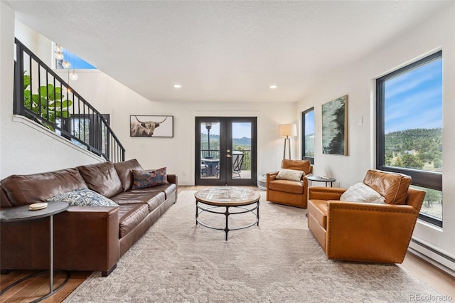 6640 Kilimanjaro Dr, Evergreen, CO 80439 - living room with carpet flooring, baseboard heating, french doors, stairs, and recessed lighting