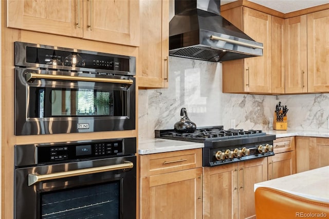 6640 Kilimanjaro Dr, Evergreen, CO 80439 - kitchen with wall chimney exhaust hood, stainless steel oven, backsplash, and black gas stovetop