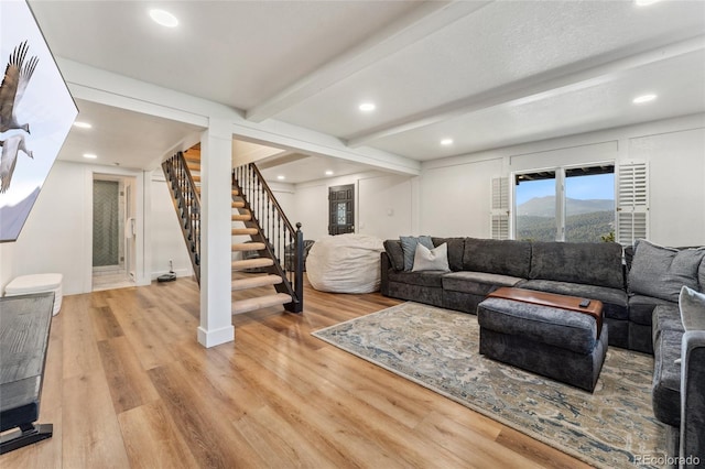 6640 Kilimanjaro Dr, Evergreen, CO 80439 - living room featuring stairway, recessed lighting, beamed ceiling, and light wood finished floors
