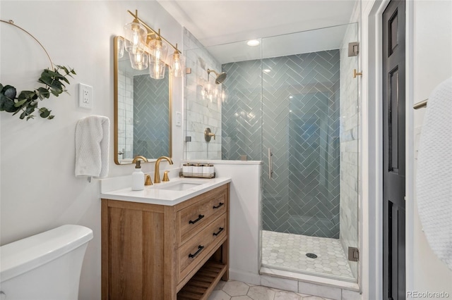 6640 Kilimanjaro Dr, Evergreen, CO 80439 - bathroom featuring vanity, tile patterned flooring, toilet, recessed lighting, and a stall shower