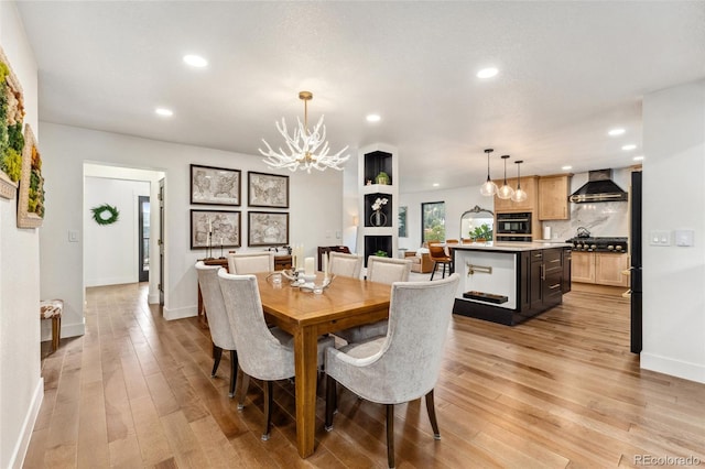 6640 Kilimanjaro Dr, Evergreen, CO 80439 - dining area featuring an inviting chandelier, baseboards, light wood finished floors, and recessed lighting