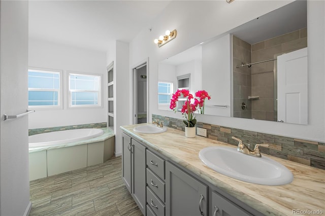 6 Timberlake Ct, Byers, CO 80103 - bathroom featuring a bath, double vanity, healthy amount of natural light, and tiled shower