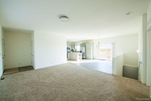 6 Timberlake Ct, Byers, CO 80103 - unfurnished living room with light colored carpet and a chandelier