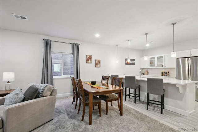 171 S Waterloo St, Aurora, CO 80018 - dining room featuring recessed lighting and light wood finished floors