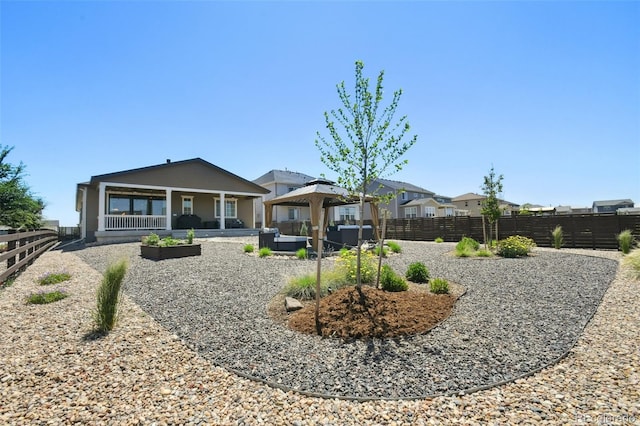 171 S Waterloo St, Aurora, CO 80018 - back of property with a gazebo, an outdoor hangout area, a fenced backyard, and a patio area