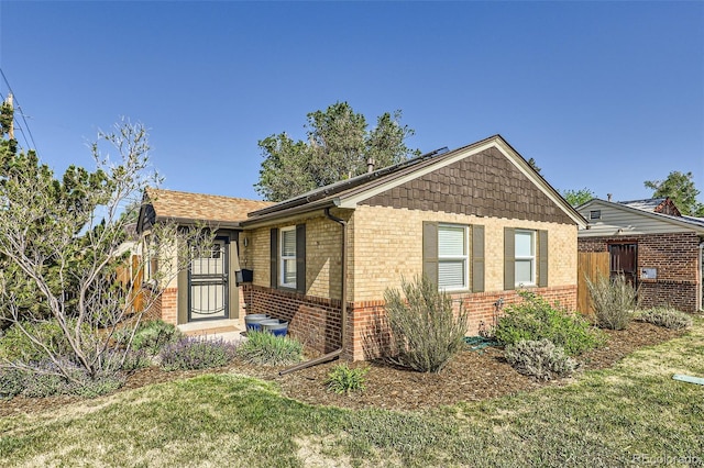 2901 N Glencoe St, Denver, CO 80207 - view of front facade with brick siding and a front lawn