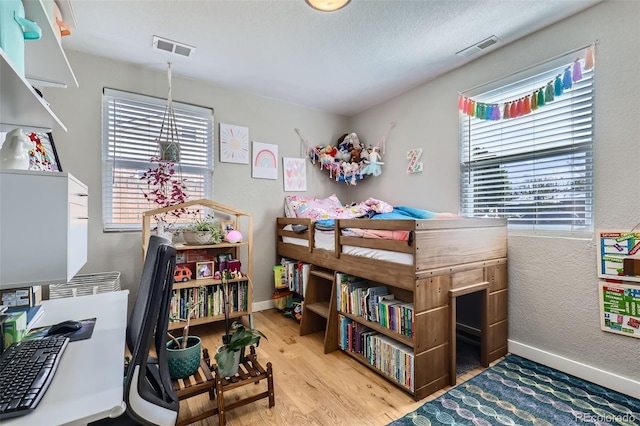 2901 N Glencoe St, Denver, CO 80207 - bedroom featuring wood finished floors and baseboards