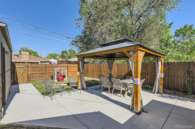 2901 N Glencoe St, Denver, CO 80207 - fenced backyard featuring a gazebo, a patio, and outdoor dining space