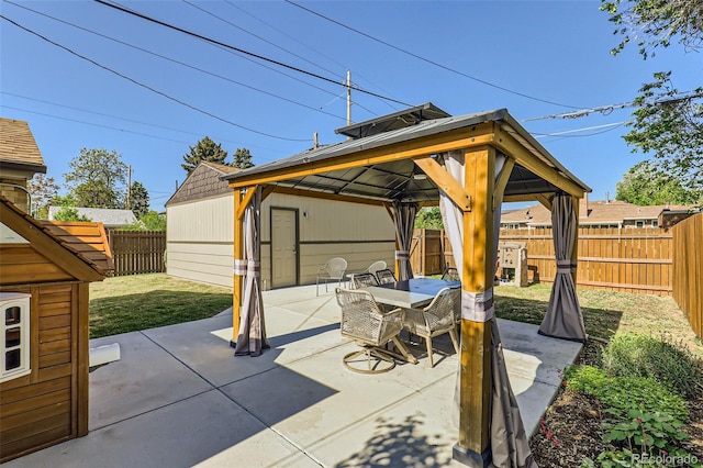 2901 N Glencoe St, Denver, CO 80207 - fenced backyard featuring a gazebo, outdoor dining space, and a patio