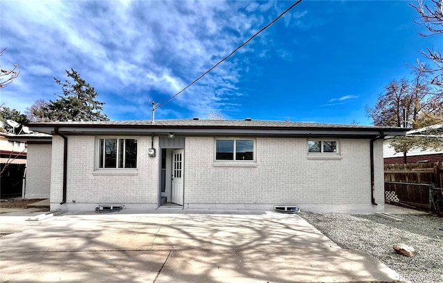 back of house with a patio