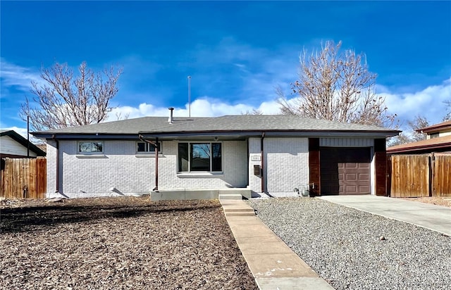 ranch-style home featuring a garage