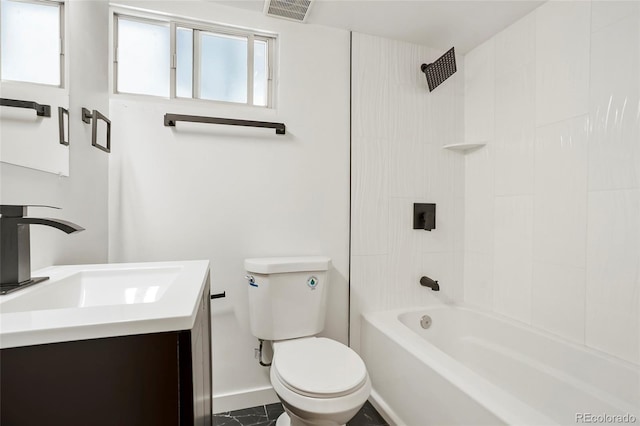 full bathroom with vanity, tiled shower / bath combo, and toilet