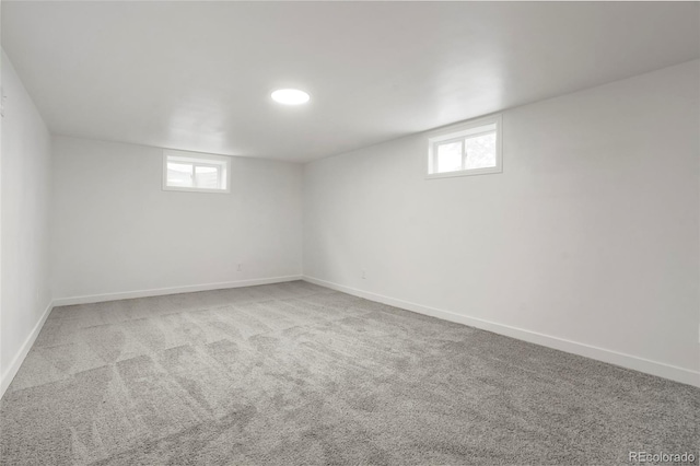 basement featuring light colored carpet