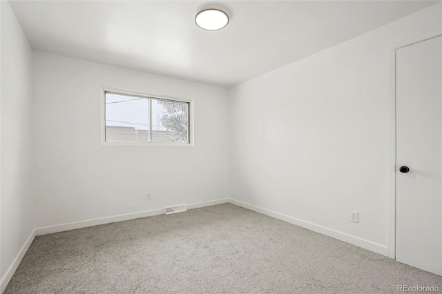 unfurnished room with carpet floors