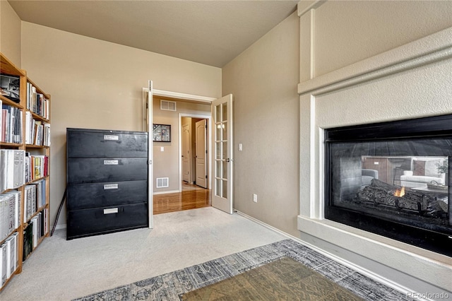 9952 Pinedale Dr, Colorado Springs, CO 80920 - unfurnished bedroom with carpet floors, baseboards, and a multi sided fireplace