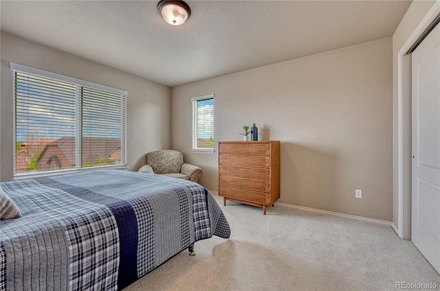 9952 Pinedale Dr, Colorado Springs, CO 80920 - bedroom with light carpet and baseboards