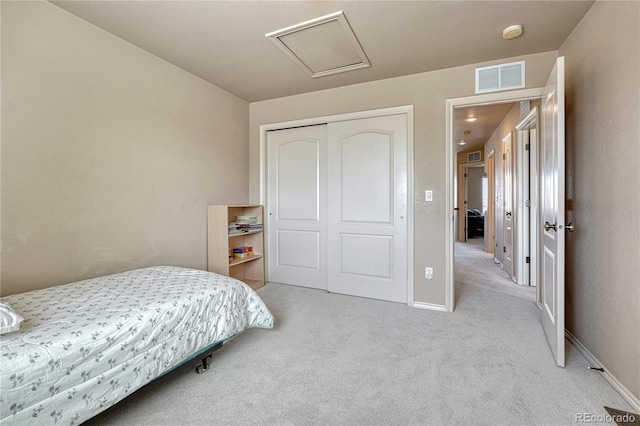 9952 Pinedale Dr, Colorado Springs, CO 80920 - bedroom featuring light carpet, attic access, a closet, and baseboards