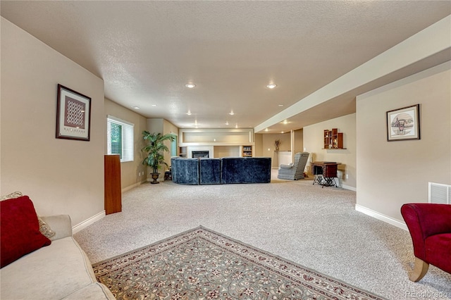 9952 Pinedale Dr, Colorado Springs, CO 80920 - living area with baseboards, carpet floors, recessed lighting, and a textured ceiling