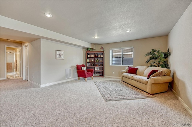 9952 Pinedale Dr, Colorado Springs, CO 80920 - carpeted living room featuring a textured ceiling, baseboards, and recessed lighting