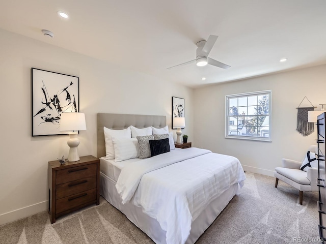 bedroom featuring ceiling fan and light carpet