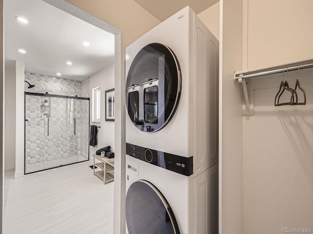 washroom with stacked washer and dryer