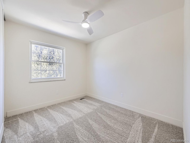 carpeted empty room with ceiling fan