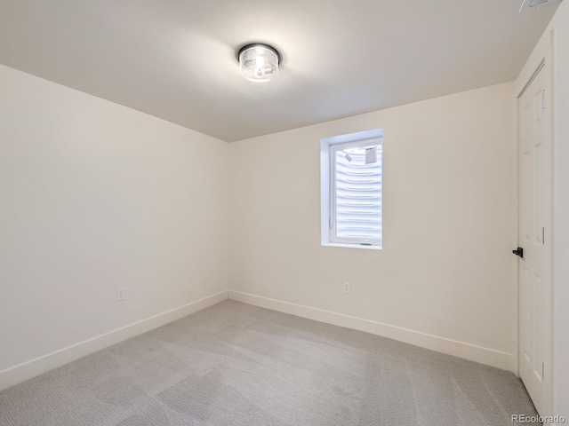 empty room with light colored carpet