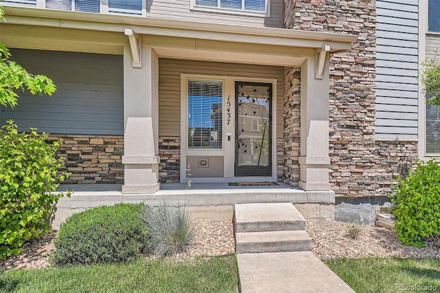 15437 W 95th Ave, Arvada, CO 80007 - property entrance with stone siding and covered porch