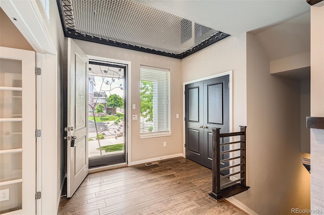 15437 W 95th Ave, Arvada, CO 80007 - entryway featuring wood finished floors and baseboards