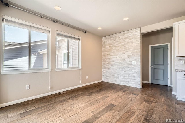 15437 W 95th Ave, Arvada, CO 80007 - unfurnished room with healthy amount of natural light, dark wood-style flooring, and recessed lighting