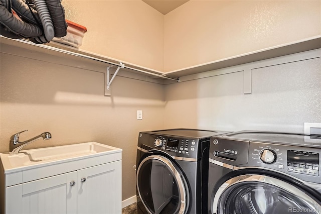 15437 W 95th Ave, Arvada, CO 80007 - laundry room with washing machine and clothes dryer and cabinet space