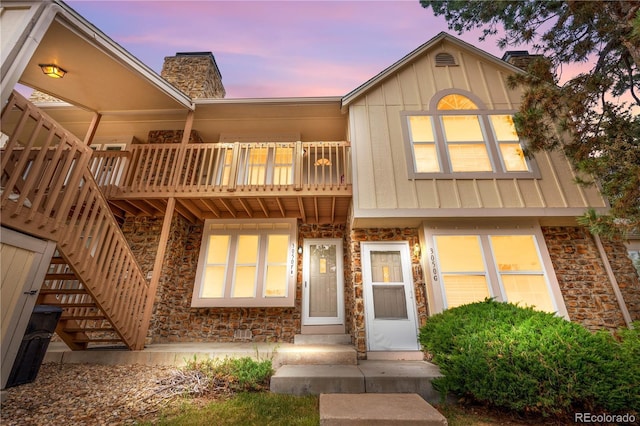 3050 W 107th Pl Unit E, Westminster, CO 80031 - multi unit property with a chimney, stone siding, board and batten siding, and a balcony