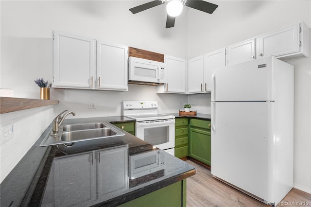 3050 W 107th Pl Unit E, Westminster, CO 80031 - kitchen with white appliances, a sink, white cabinetry, a ceiling fan, and light wood-type flooring