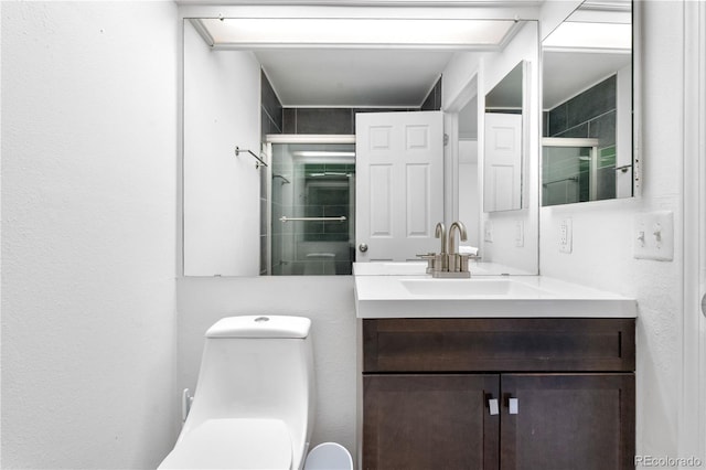 3050 W 107th Pl Unit E, Westminster, CO 80031 - bathroom featuring vanity, toilet, and a shower with shower door