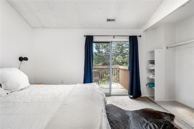 3050 W 107th Pl Unit E, Westminster, CO 80031 - bedroom with access to outside, carpet flooring, a textured ceiling, and baseboards