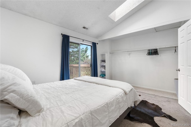 3050 W 107th Pl Unit E, Westminster, CO 80031 - bedroom featuring carpet flooring, lofted ceiling, and a textured ceiling
