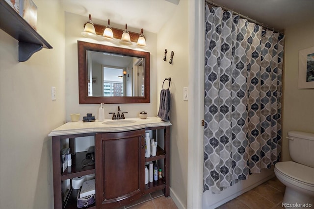 bathroom with tile patterned floors, vanity, and toilet