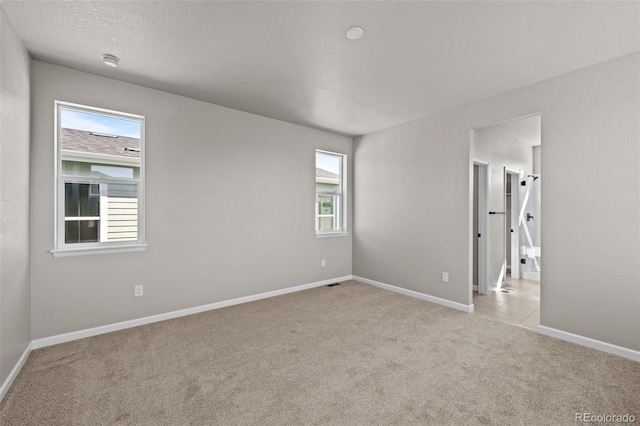 21044 E 63rd Dr, Aurora, CO 80019 - unfurnished room with light colored carpet, baseboards, and a smoke detector