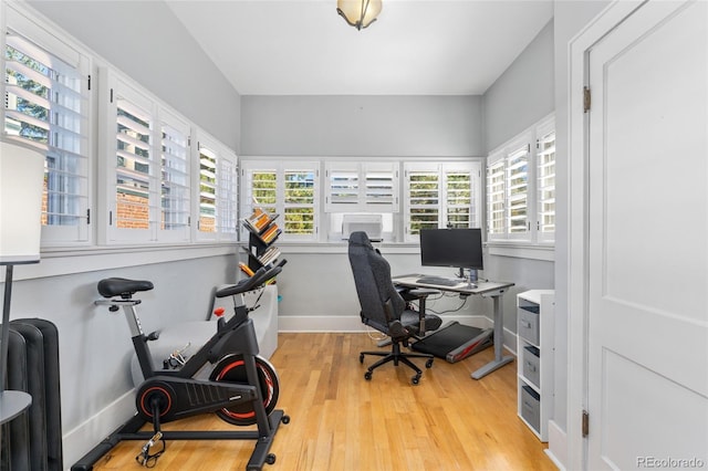 office area with wood finished floors and baseboards