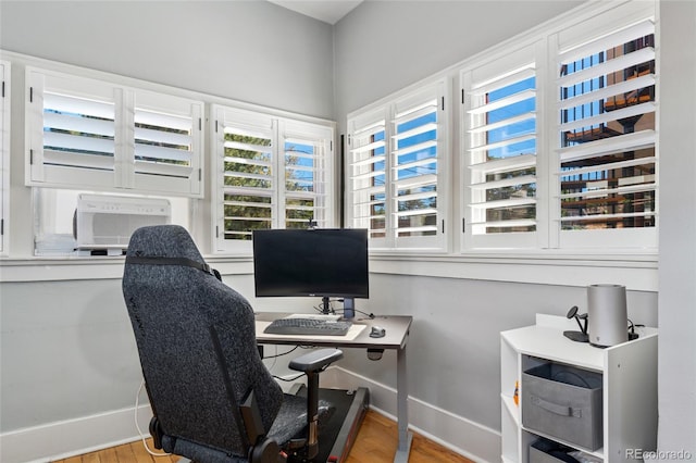 office with wood finished floors and baseboards