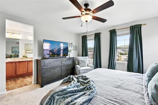 3699 Makley Cir, Castle Rock, CO 80104 - bedroom featuring light colored carpet, connected bathroom, and a ceiling fan