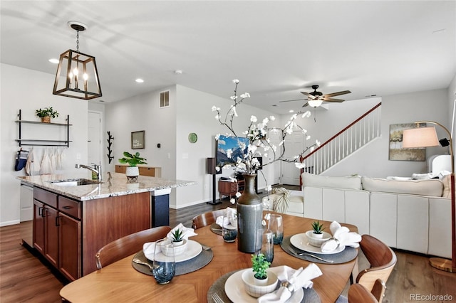 3699 Makley Cir, Castle Rock, CO 80104 - dining space featuring dark wood-style flooring, recessed lighting, a ceiling fan, a chandelier, and baseboards