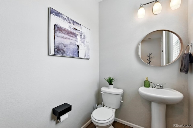 3699 Makley Cir, Castle Rock, CO 80104 - bathroom with toilet, baseboards, a sink, and wood finished floors