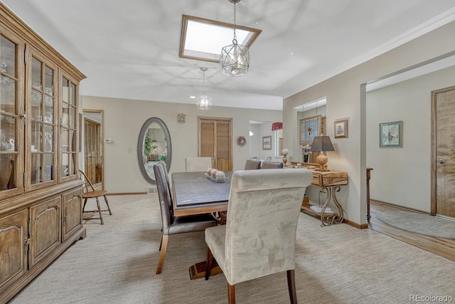 30 Eagle Dr, Littleton, CO 80123 - dining space featuring a skylight, light carpet, and baseboards