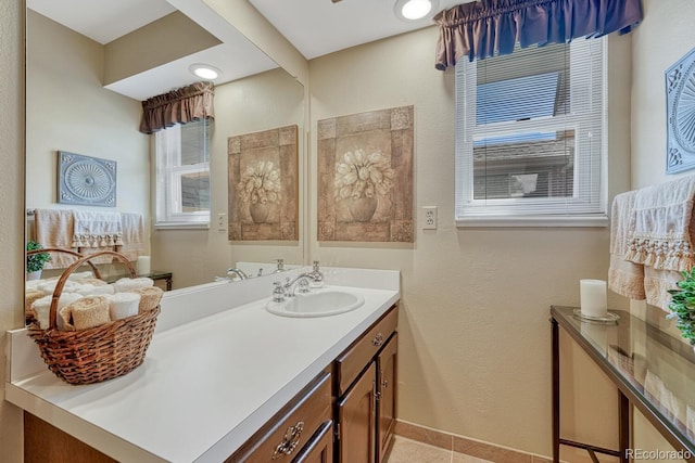 30 Eagle Dr, Littleton, CO 80123 - bathroom featuring vanity, tile patterned floors, and baseboards