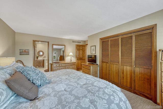 30 Eagle Dr, Littleton, CO 80123 - carpeted bedroom featuring a closet and ensuite bath