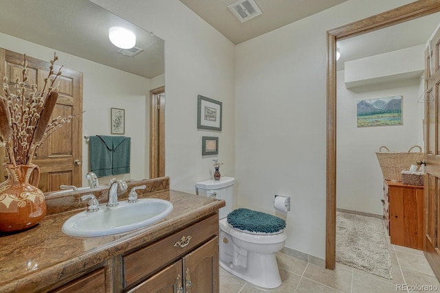 30 Eagle Dr, Littleton, CO 80123 - bathroom with tile patterned flooring, toilet, and vanity